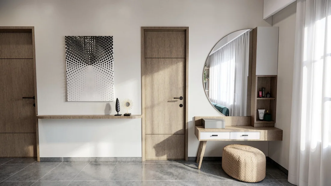 A sculptural curved dressing mirror above a floating white-and-wood vanity and woven stool.