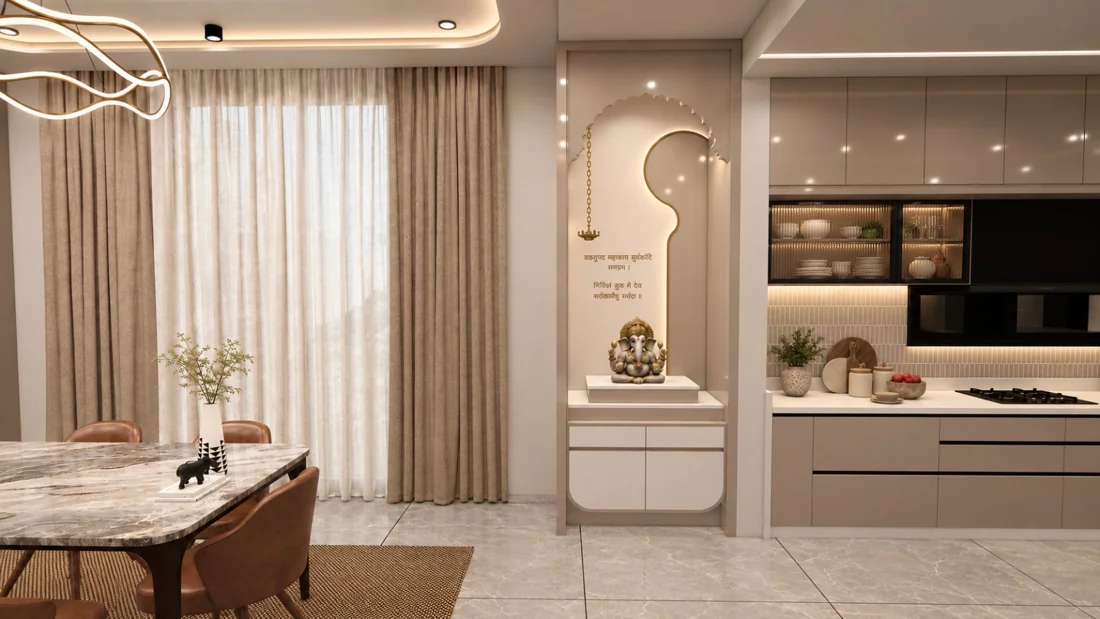 An open dining and kitchen layout with a marble table, taupe cabinets and an integrated pooja niche.
