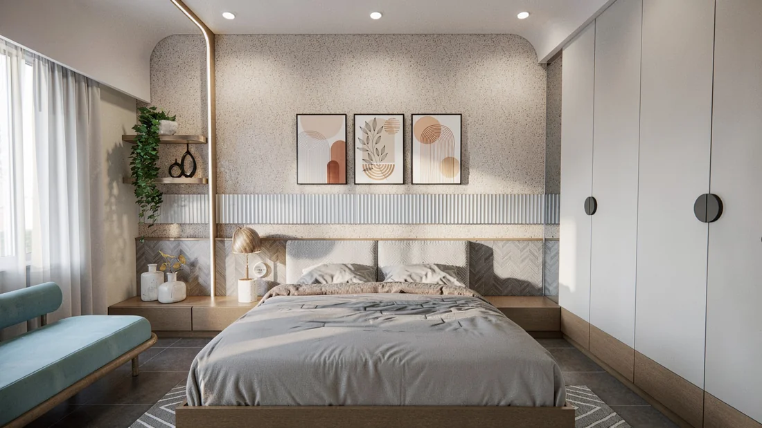 A neutral bedroom with curved wall details, framed artwork and white full-height wardrobes.